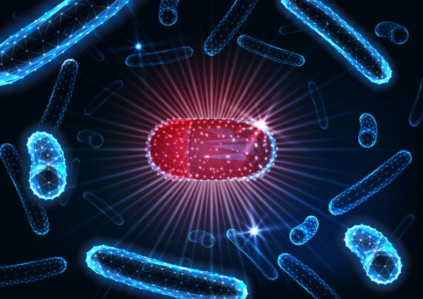 Antibiotics pills in bacteria medium concept2e00 Futuristic drug capsule among bacilli microorganisms2e00
