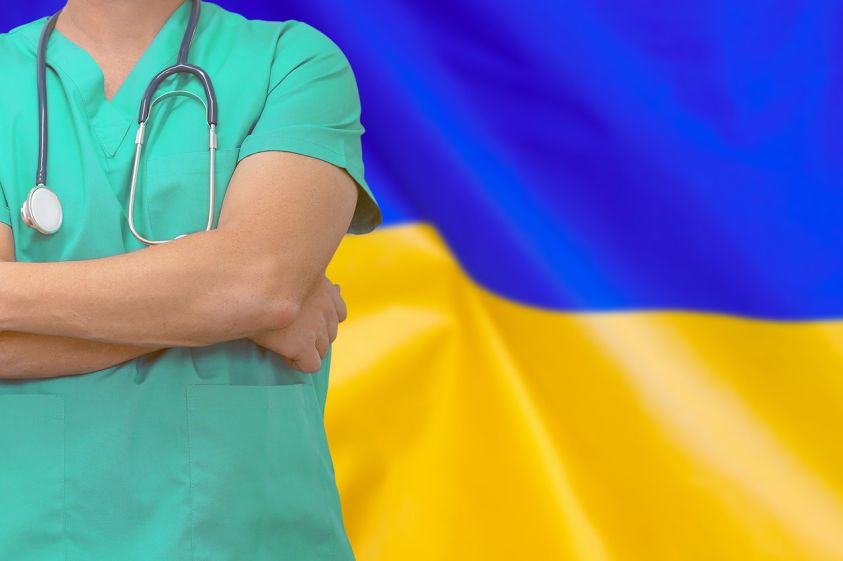 Man surgeon or doctor with stethoscope on the background of the Ukraine flag2e00 Health care, surgery and medical concept in Ukraine2e00